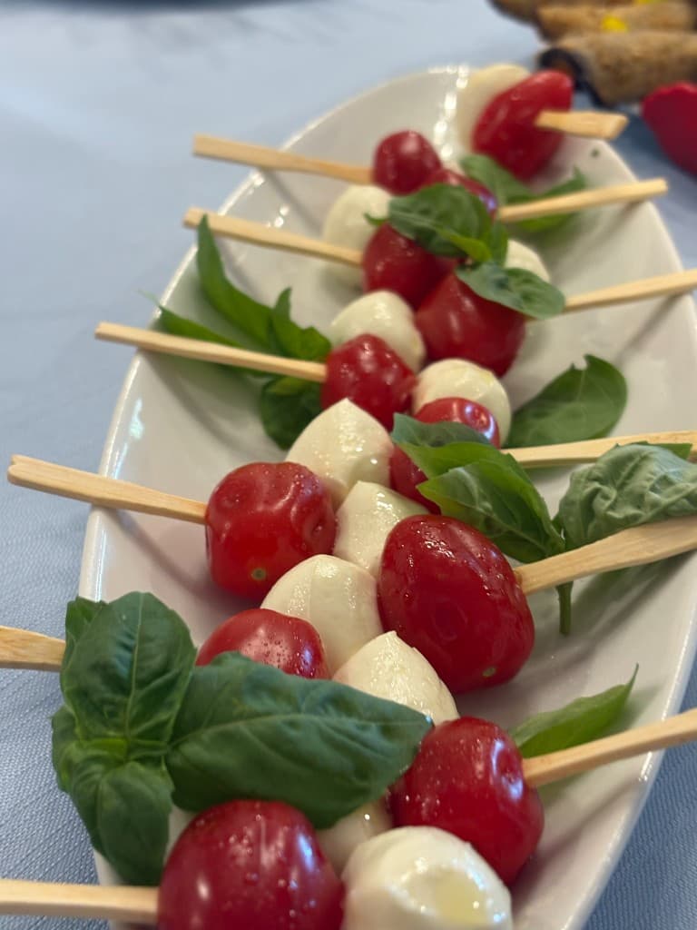 Caprese skewers with cherry tomatoes, mozzarella, and basil