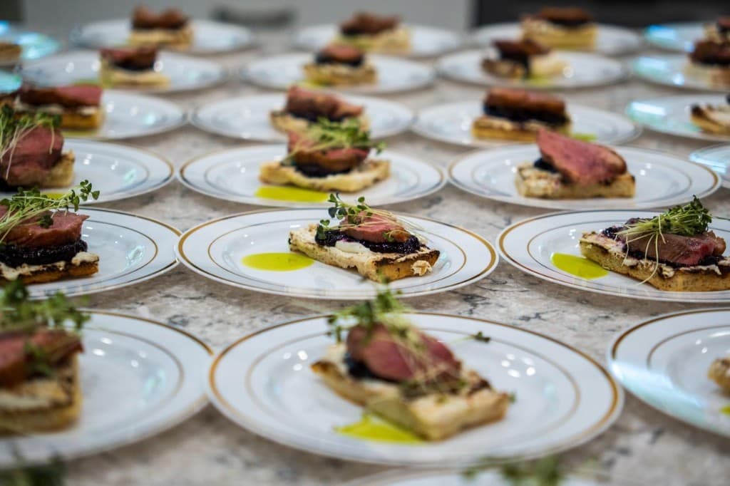 Duck course plated across multiple dinner plates