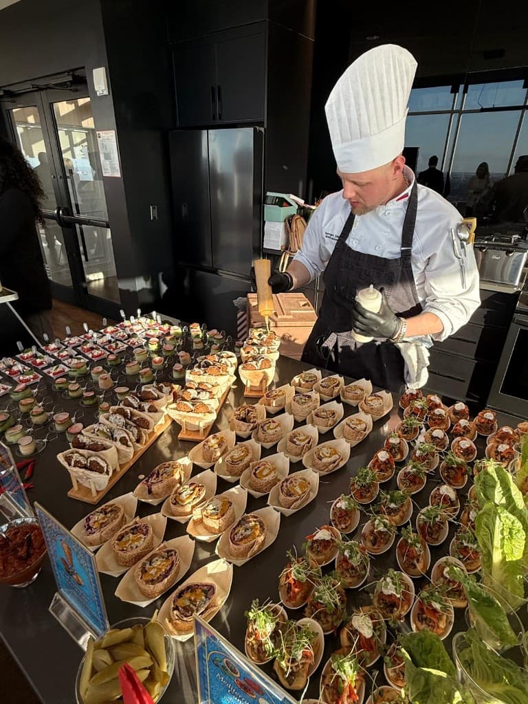 Chef Sergei preparing Mediterranean-inspired bites at an event station