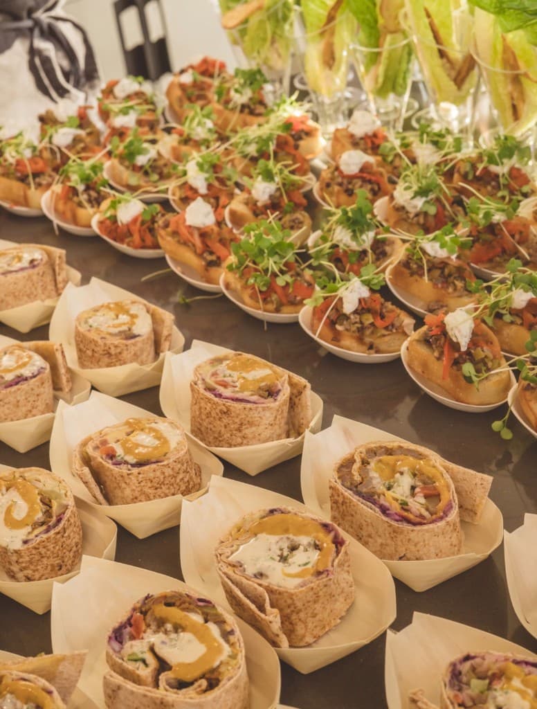 Mediterranean wraps and falafel bites arranged on the catering station